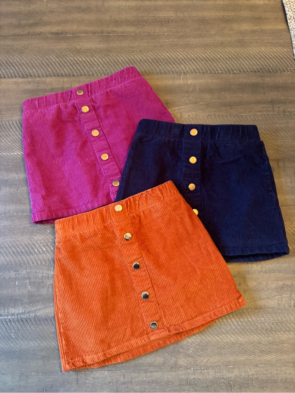 Isaac Mizrahi Corduroy Button-Front Mini Skirts bundle in Pink, Navy, and Rust